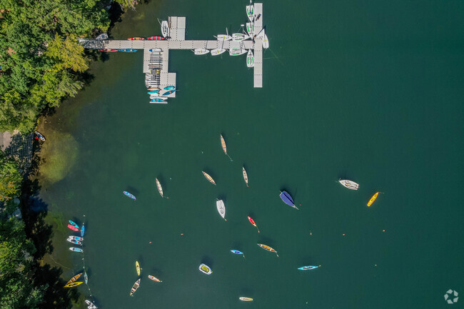 Overview of boat dock and anchored boats in Farm Pond in Sherborn.