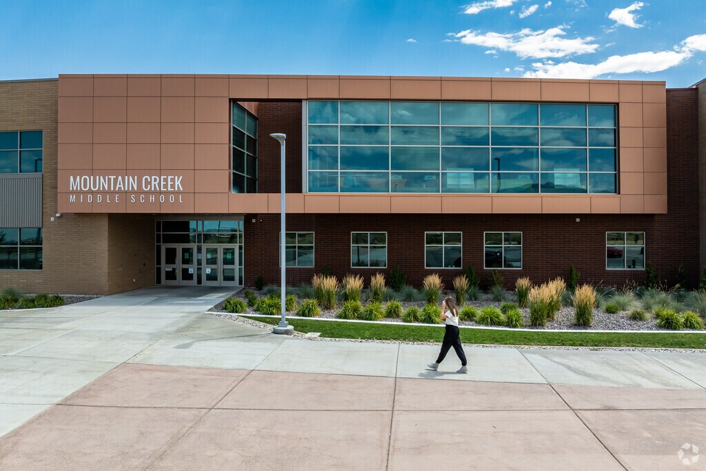 A student walks in front of Mountain Creek Middle School.