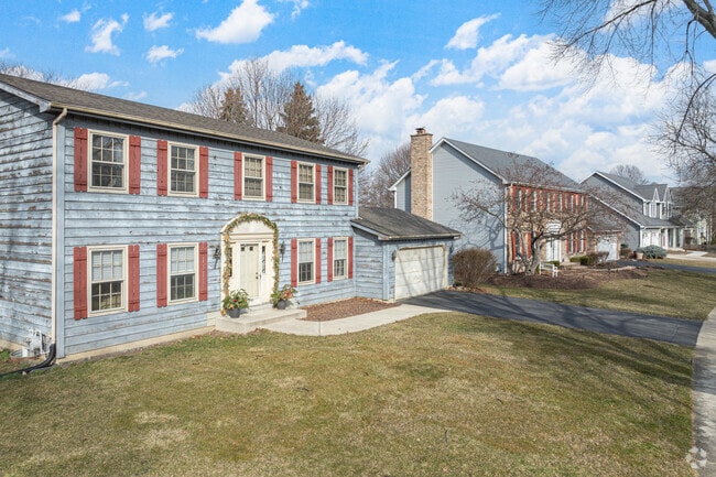 Watts features pampered lawns with neatly trimmed hedges and oval walkways.