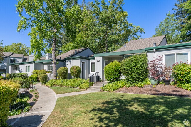 A row of condos in Sycamore Valley are situated in a garden setting with  walking trails.