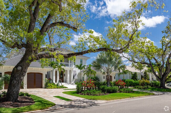 Aqualane Shores features coastal homes with large trees and thoughtful landscaping.