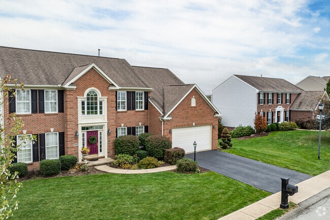 Colonial Revival homes line quiet streets in Unity Township.