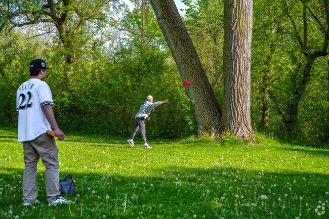Playing a round at Lime Kiln Parks Disc Golf course.