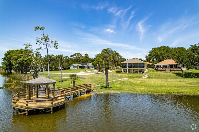 Docks attached to contemporary two-story and ranch-style homes with waterfront views along Lake Umatilla.