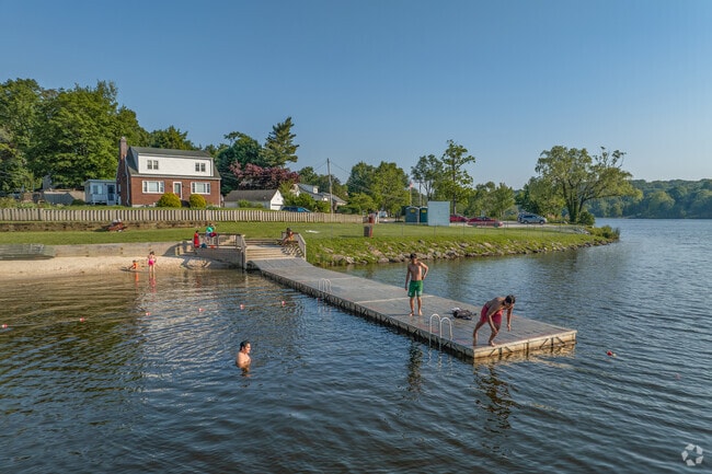 The lake becomes the neighborhood hangout when the heat kicks in and kids are ready to dive in.