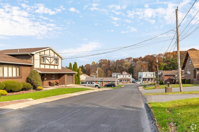Yatesville, PA features spacious lots with mid-century homes and tree-lined roads.