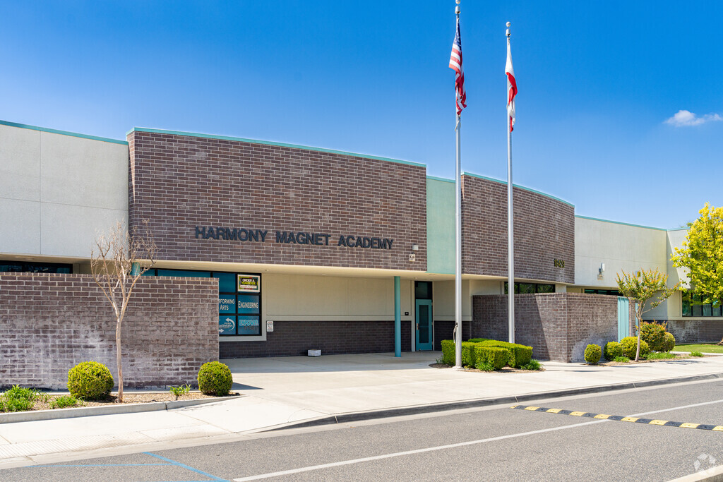 An American flag waves above the entrance to Harmony Magnet Academy in Strathmore.