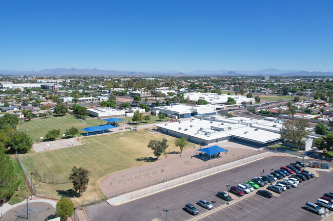 Curry Elementary in Tempe includes a playing field with a playground and basketball court.