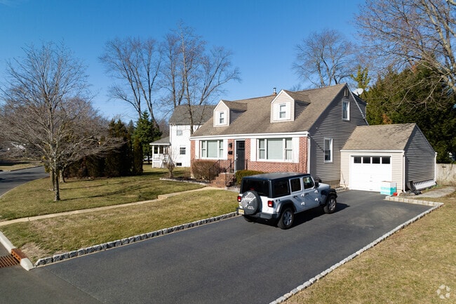 Colonial style homes offer a classic aesthetic to the neighborhood.