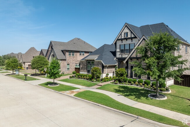 Most homes in Windsong Ranch feature elegant brick and stone facades.