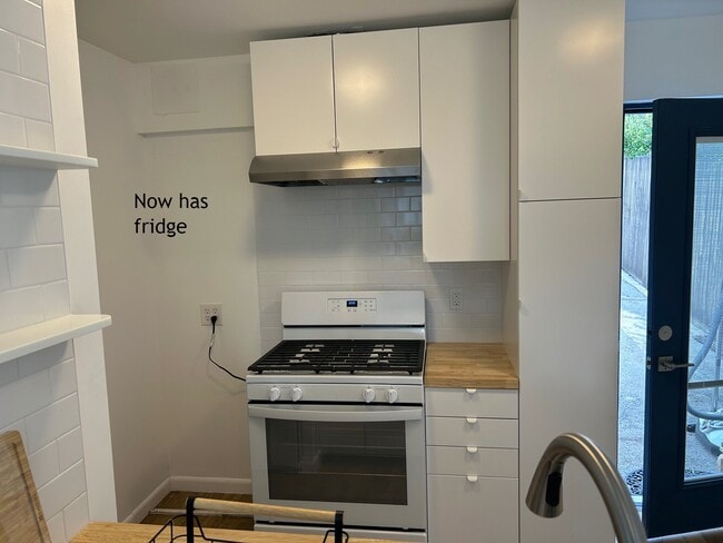 kitchen now has fridge