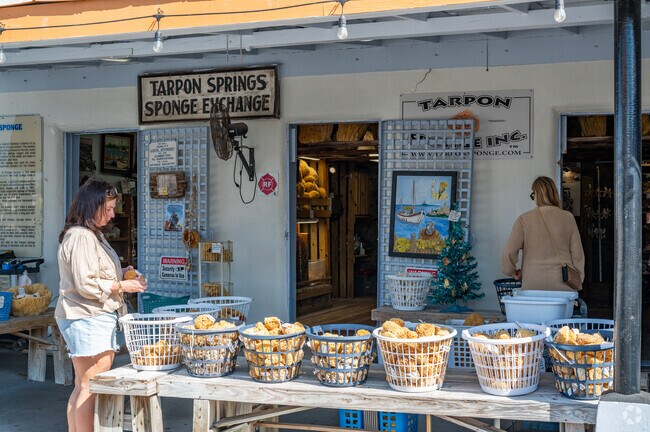 Tarpon Springs travelers soak up the shops at the Sponge Exchange.