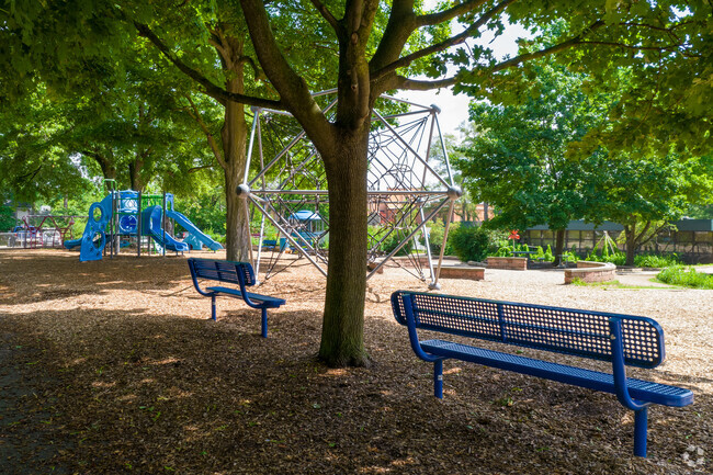 Students can rest in the shade after burning all their energy at Bach Elementary School.