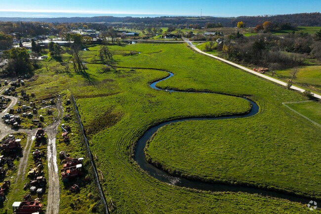 Mill Creek flows north of Chatfield, offering trout fishing and kayaking spots.
