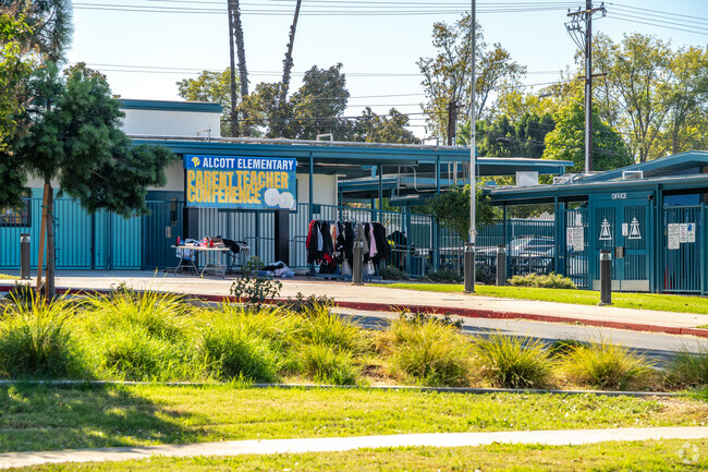 Enter Alcott Elementary School through its welcoming entrance.