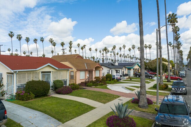 Palm tree backdrop behind the cozy cottages of Chesterfield Square.