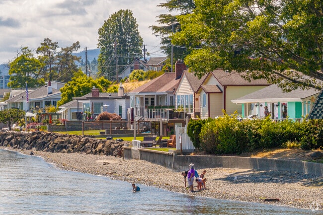 A family enjoys the water at Bachman Park off the coast of Bremerton.