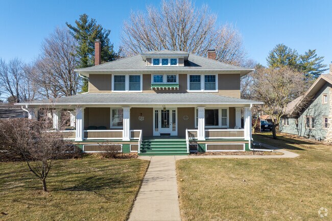 Bungalows in Lincoln, IL have distinct characteristics like this home with green steps and front porch.