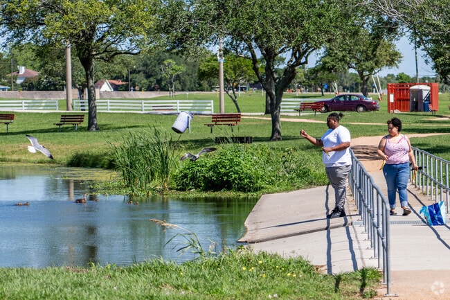 Residents of East Texas City feed the fish and birds at Tarpey Park.