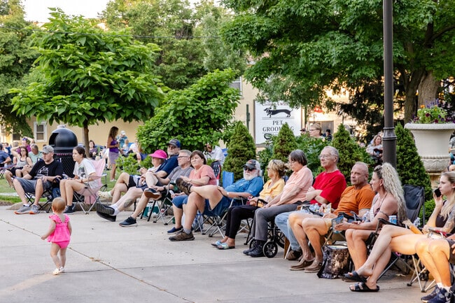St. Charles residents gather in Lincoln Park to enjoy live music by Industrial Drive.