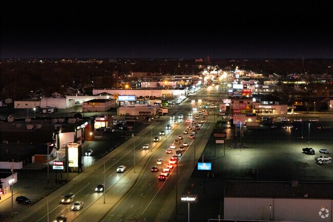 Chain retail and fast food line Division Street to the west of Colonial Gardens.