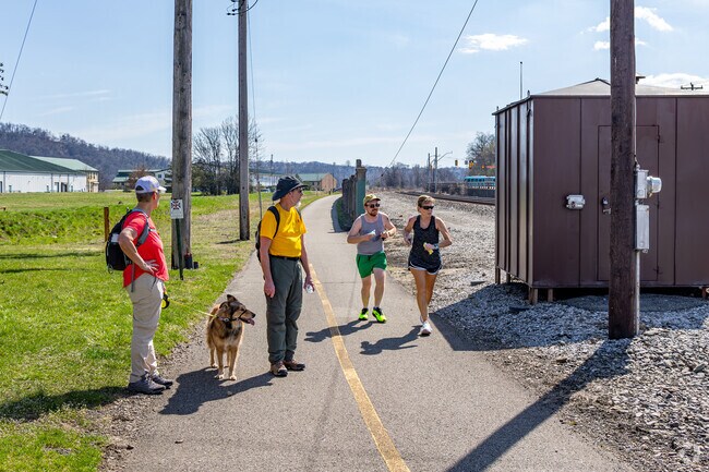 Joggers and walkers enjoy the Great Allegheny Passage trail in Duquesne.