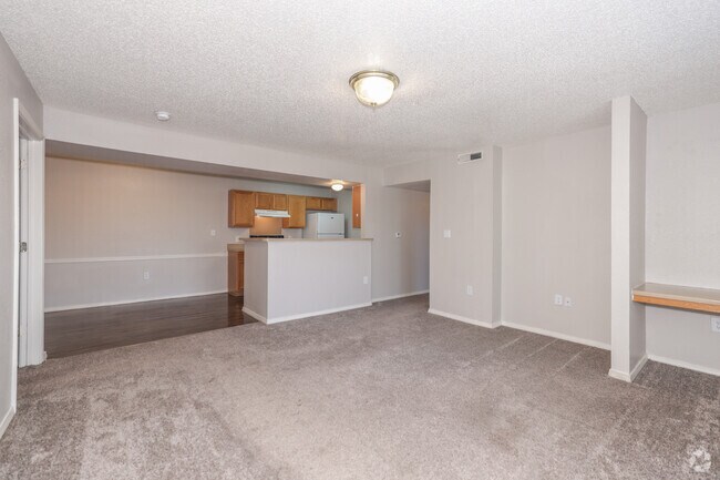 2BR, 2BA - 908SF - Living Room, Dining Area and Kitchen