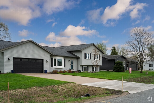 Large split‑level homes cluster near Roth Field in Brice Prairie.