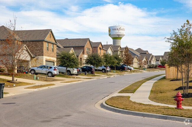 A row of newly developed traditional and national style homes common in Buda.