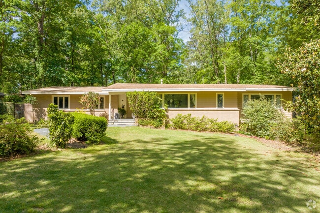 Hillwood ranch-style home includes a generous front yard.