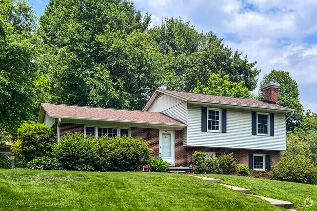 Split-level homes line meandering residential streets in Royal Pines.