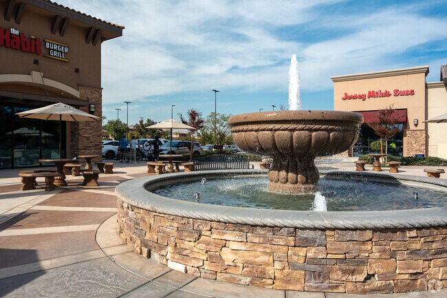 Make a wish at the fountain in the shopping center near Brimhall Estates.