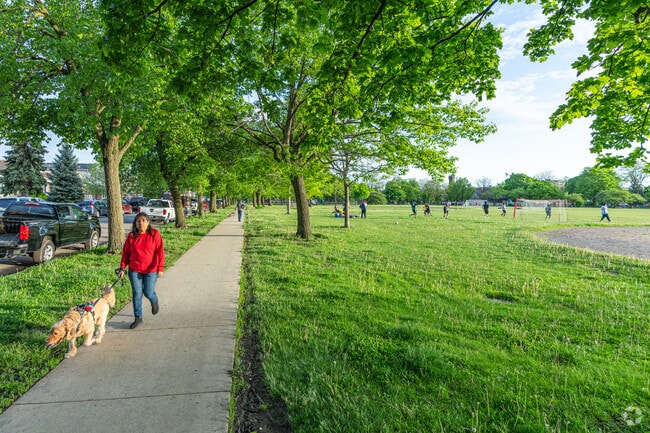 Residents take in the walking paths at Pasteur Park in West Elsdon.