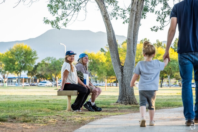 Residents can relax on the benches at Veterans Memorial Park and enjoy the mountain views.