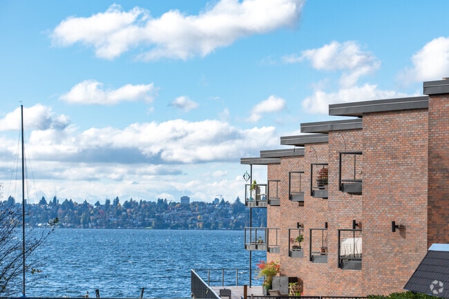 Waterfront condos along Lake Washington in Lakeview Kirkland, offering sweeping views of the water and the Seattle skyline across the bay.