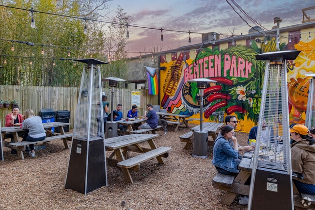 Red's Beer Garden is the go-to hotspot in Benteen Park, where friends come together to unwind and enjoy great brews in a lively atmosphere.