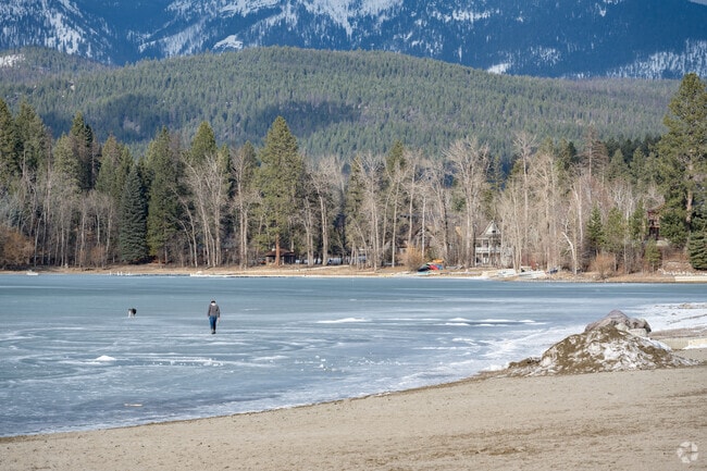 A man and his dog demonstrate new ways to explore Whitefish Lake in winter.