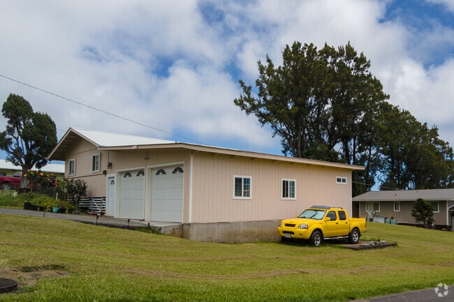 Most homes have garages and simple yards.