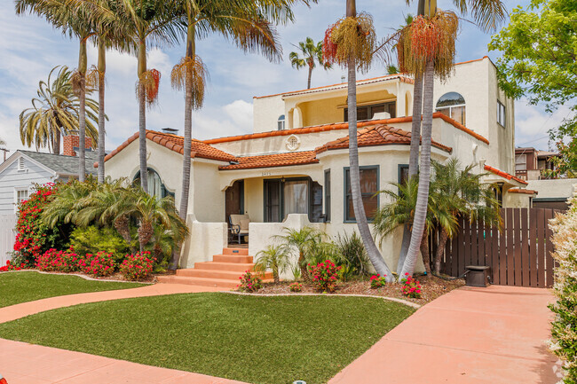 Large trees surround a Spanish Revival home in Burlingame.