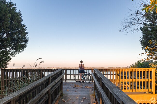 You can view the beautiful sunset overlooking the ocean at Longmeadow Beach in Long Meadow, RI.