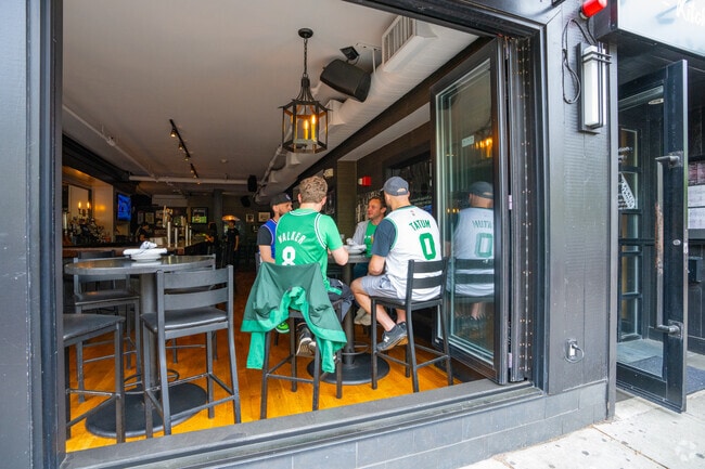 Enjoy food and drinks with an indoor-outdoor vibe at 710 Tavern near Riverside.