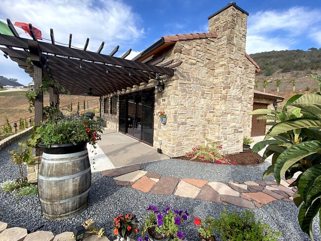 Main entrance to stone villa with private garage, patio, spa—breathtaking views!