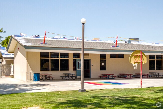 The Kindergarten recess area at Cole Elementary School keeps young children safe while playing.