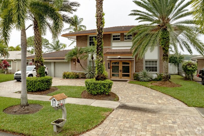 Updated homes with lush landscaping are common in the Flamingo Gardens neighborhood.
