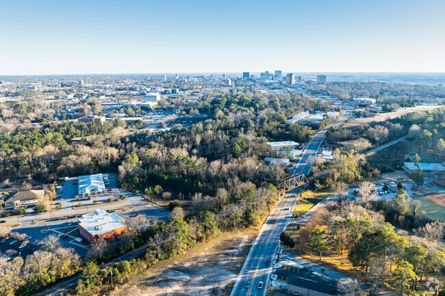 Eau Claire's origins as a railroad suburb highlight its importance in Columbia's growth.