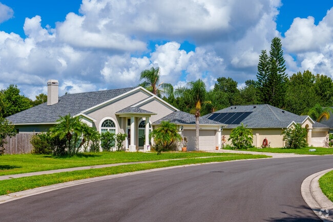 A row of pristine homes reflects the pride of ownership in Live Oak Reserve.