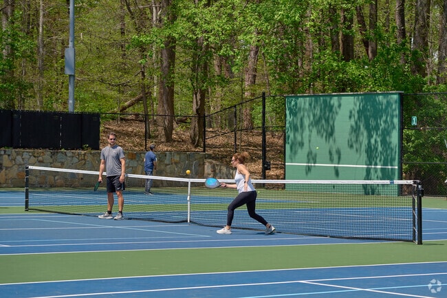 A family enjoys a game of Pickle Ball at Potomac Overlook Regional Park.