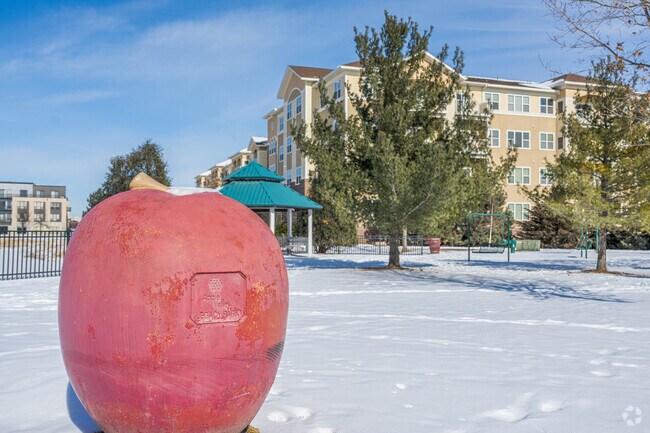 Legacy Park is situated around a pond and is marked with apple statues