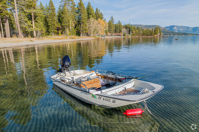 A small fishing boat sets anchor in the Shallow waters of Tahoe Vista.