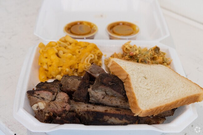 No Sauce BBQ offers ribs with a side of Seafood Salad and Macaroni.